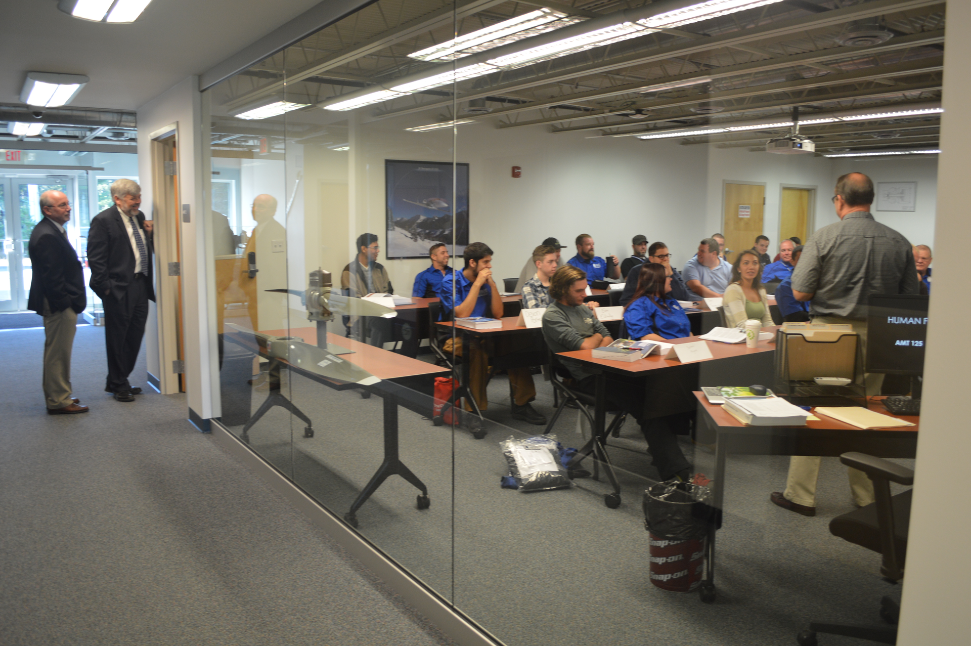 Dean Robert Cody, President John Cox (L-R) observing the classroom at CCCC.