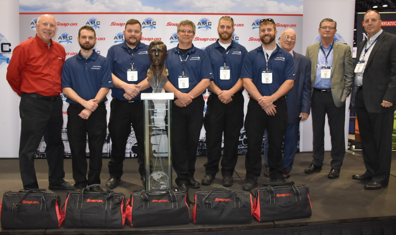 Photo identification (left to right): Tom Murray, Director, Marketing and Business Development, Snap-on Industrial; Bryan Brown, United Airlines; John Waldeck, United Airlines; Brian Hall, United Airlines; Garrett Morrison, United Airlines; R.J. Peterson, United Airlines; John Goglia, president, Aerospace Maintenance Council; Don Wright, United Airlines; James Montgomery, United Airlines.
