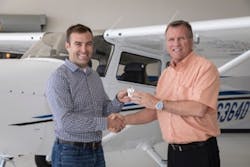 Suburban President Scott Trumbull (left) accepts delivery of first Yingling Ascend 172 from Yingling CEO Lynn Nichols (right).