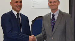 PPG and Vision Systems have reached a commercial agreement to work together on developing new applications utilizing Vision Systems’ electronically dimmable window shading product for aircraft. At a display of the product are Nicolas Laurent, left, Vision Systems Aeronautics sales director, and Brent Wright, PPG global business director for aerospace transparencies.