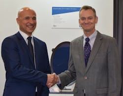 PPG and Vision Systems have reached a commercial agreement to work together on developing new applications utilizing Vision Systems’ electronically dimmable window shading product for aircraft. At a display of the product are Nicolas Laurent, left, Vision Systems Aeronautics sales director, and Brent Wright, PPG global business director for aerospace transparencies. PPG and Vision Systems have reached a commercial agreement to work together on developing new applications utilizing Vision Systems’ electronically dimmable window shading product for aircraft. At a display of the product are Nicolas Laurent, left, Vision Systems Aeronautics sales director, and Brent Wright, PPG global business director for aerospace transparencies.