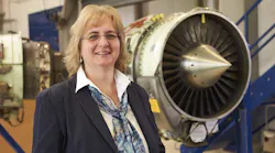 Andrea Weyrich, Manager Maintenance Engine Shop, shown with a TFE731-series engine.