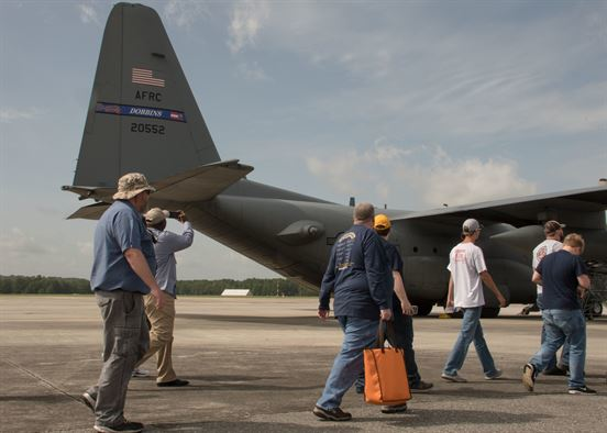 Students and faculty members from the Aviation Institute of Maintenance school tour the Dobbins flightline June 23, 2017. The students walked around a C-130H3 Hercules parked on the flightline before heading into a hangar to get a firsthand look at one undergoing maintenance.