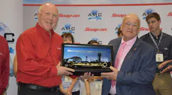 John Goglia receives the Golden Wrench Award from Snap-on's Tom Murray at the AMC in Orlando.