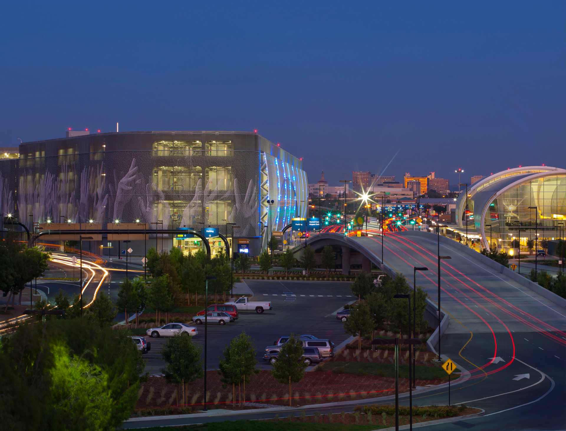 Caption: Prominently sited at the San Jose Mineta International Airport&rsquo;s entry point, the Terminal B ConRAC and Parking Structure greets visitors with monumental public art on its east fa&ccedil;ade that faces a major freeway leading to downtown San Jose.