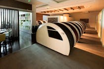 The lounge contains sleeping pods for passengers.