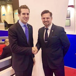 AsBAA&apos;s Mike Walsh shaking hands with Tim Wood, Corporate Business Development Executive, Royal Aeronautical Society - making new collaboration between AsBAA and RAS