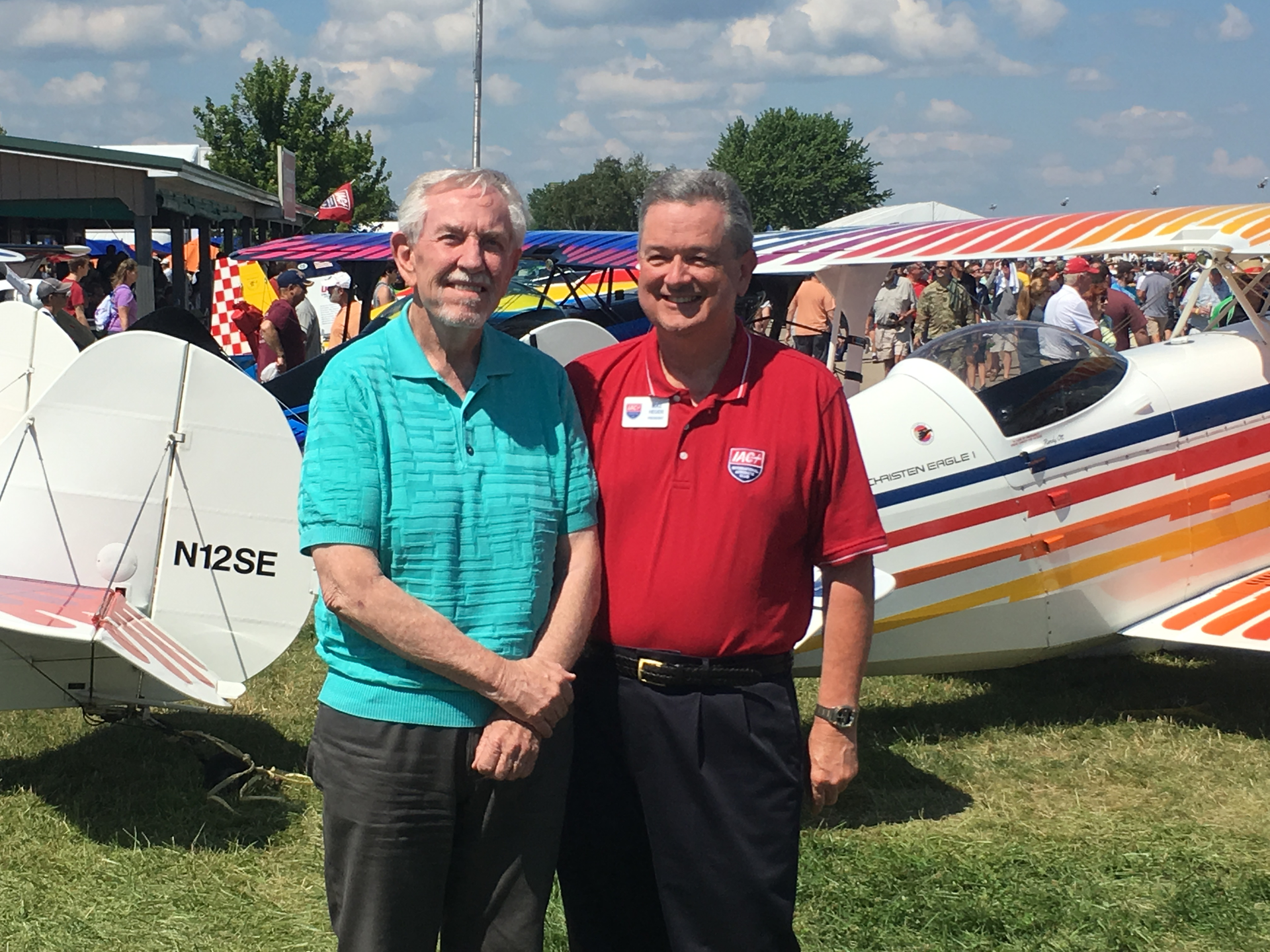 Frank Christensen (left), shared a moment with IAC President Mike Heuer at AirVenture this summer.