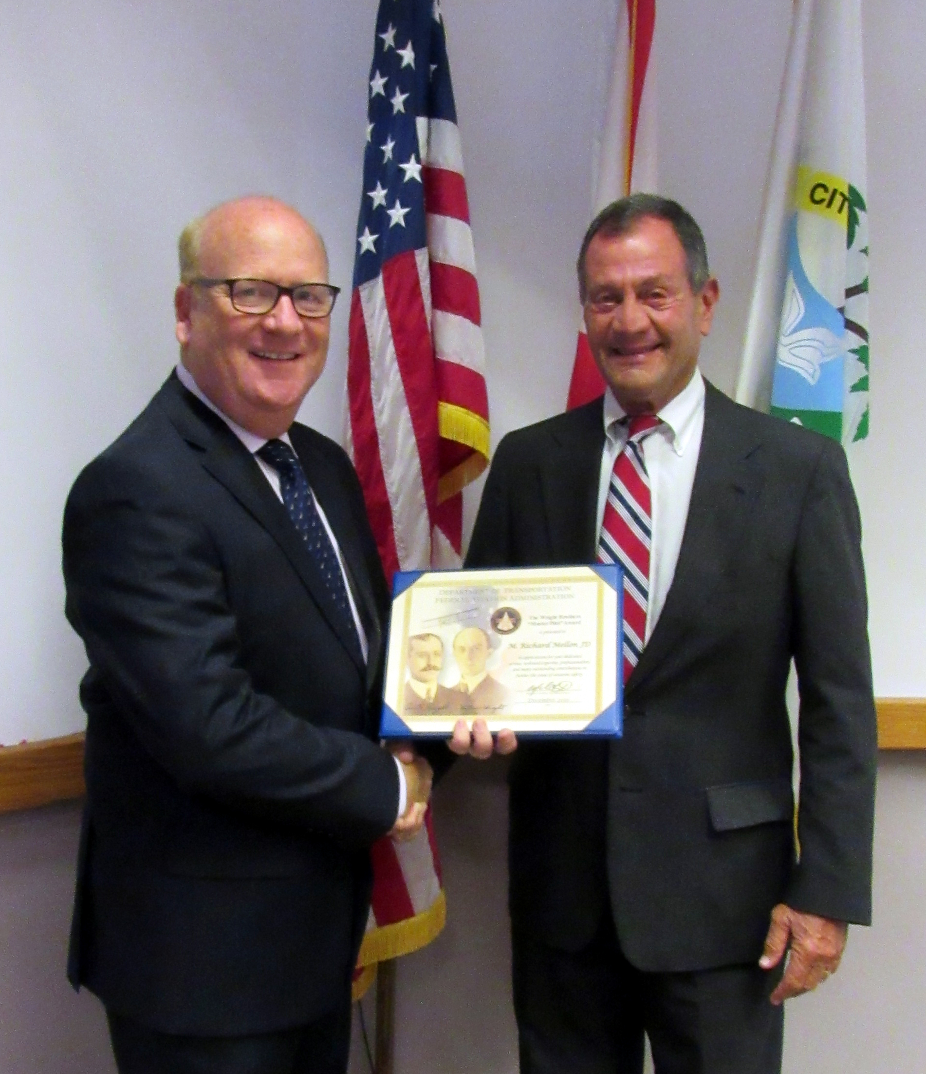 H Matthew Simpson Faa Safety Team Lead Representative Presented M Richard Mellon With Its Wright Brothers Master Pilot Award 596cba1e4867a