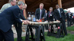 Log cutting ceremony: (left to right) CFO of Cutter Aviation Steve Prieser, Director of Special Projects of Cutter Aviation Mike Livezey, Colorado Springs Mayor John Suthers, CEO of Cutter Aviation Will Cutter, Colorado Springs Director of Aviation Greg Phillips, Cutter Aviation Colorado Springs General Manager Calvin Martin.