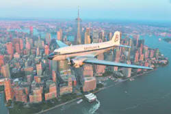 The Breitling DC 3 flies over New York city on it's world tour. The Breitling DC 3 flies over New York city on it's world tour.
