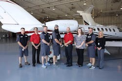 Members of Duncan Aviation&apos;s CJ3 team pose with another upgraded aircraft just before it delivers to an excited operator.