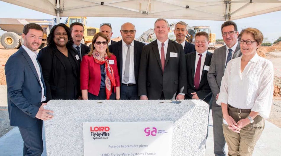 LORD leadership and local officials place the ceremonial &apos;first stone&apos; for the company&apos;s new aerospace center in France.