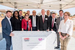 LORD leadership and local officials place the ceremonial &apos;first stone&apos; for the company&apos;s new aerospace center in France.