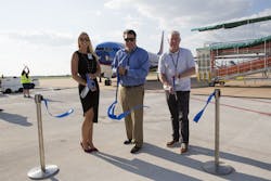 Sarah Beaver, Operations Director, Vasey Aviation Group; Shane Harbinson, Assistant Director, Airport Planning and Development, ABIA; and Lee Lancaster, Director, Business Development , LoneStar Airport Holdings, LLC cut the ribbon on Sun Country Airlines&apos; inaugural flight from Minneapolis/St. Paul, Minnesota to Austin, Texas.
