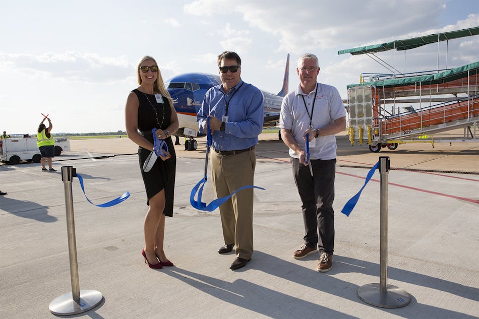 Sarah Beaver, Operations Director, Vasey Aviation Group; Shane Harbinson, Assistant Director, Airport Planning and Development, ABIA; and Lee Lancaster, Director, Business Development , LoneStar Airport Holdings, LLC cut the ribbon on Sun Country Airlines&apos; inaugural flight from Minneapolis/St. Paul, Minnesota to Austin, Texas.