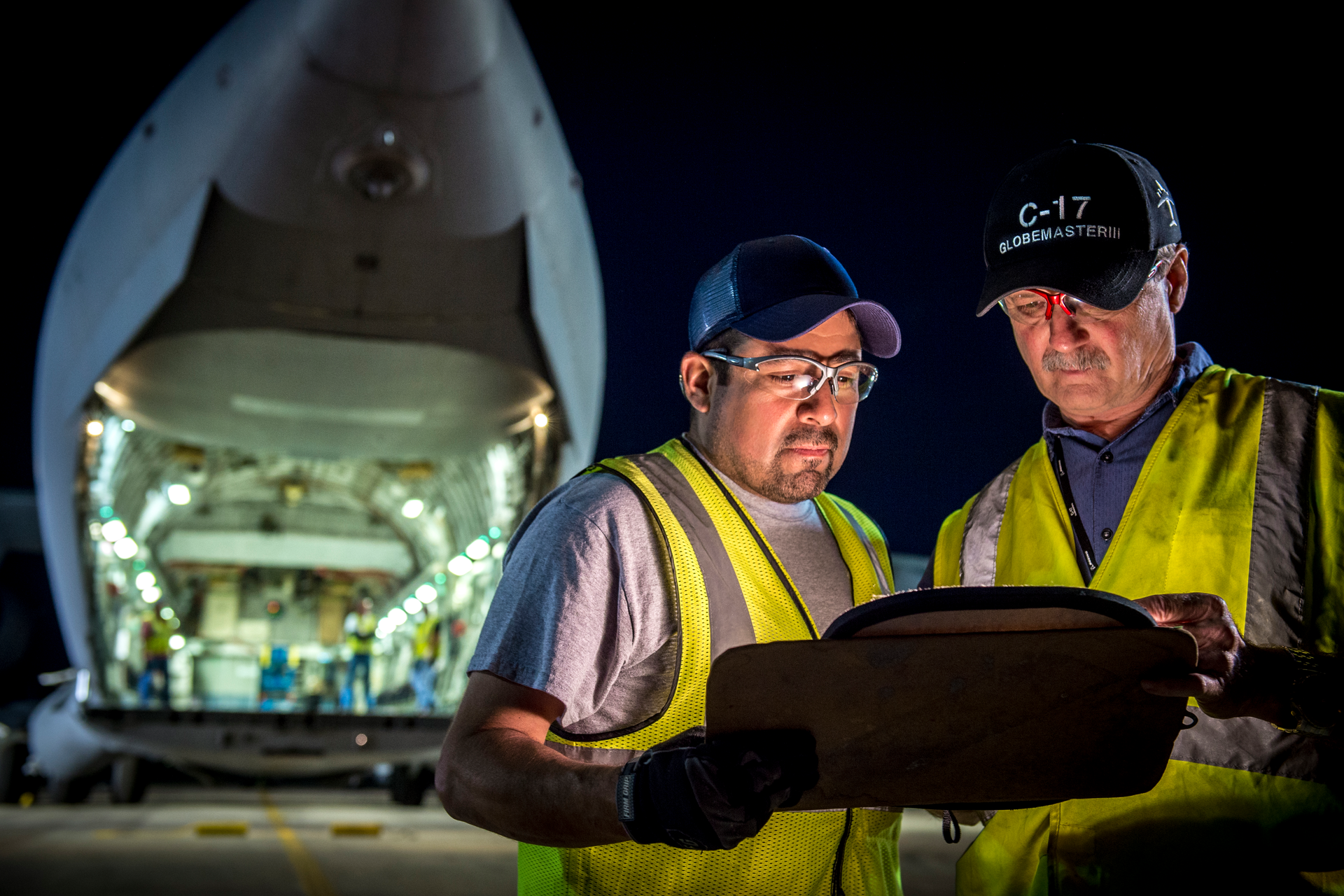 Boeing Global Services employees Michael Gutierrez (left) and Robert Zoricic perform maintenance, repair and overhaul to ensure the global C-17 Globemaster III fleet is always ready and evolving through continuous technology upgrades, including using data analytics to optimize predictive maintenance capabilities and minimize unscheduled maintenance. Boeing is the original equipment manufacturer for the C-17, and has provided sustainment to the fleet since delivery of the first aircraft in 1993.