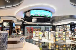 The 3mm Nixel SeriesTM fine-pitch LED halo display by Nanolumens, suspended like a digital chandelier from the store&rsquo;s ceiling, makes shoppers aware of brands and promotions, no matter where they are in the duty-free store.