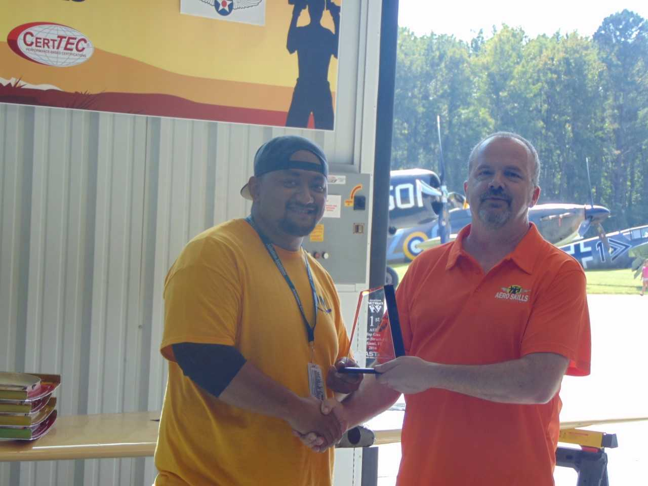 From left to right: Kilifi Maluafou, Aviation Institute of Maintenance student and presenting award, Jay Logi, Aircraft Technologies Group.