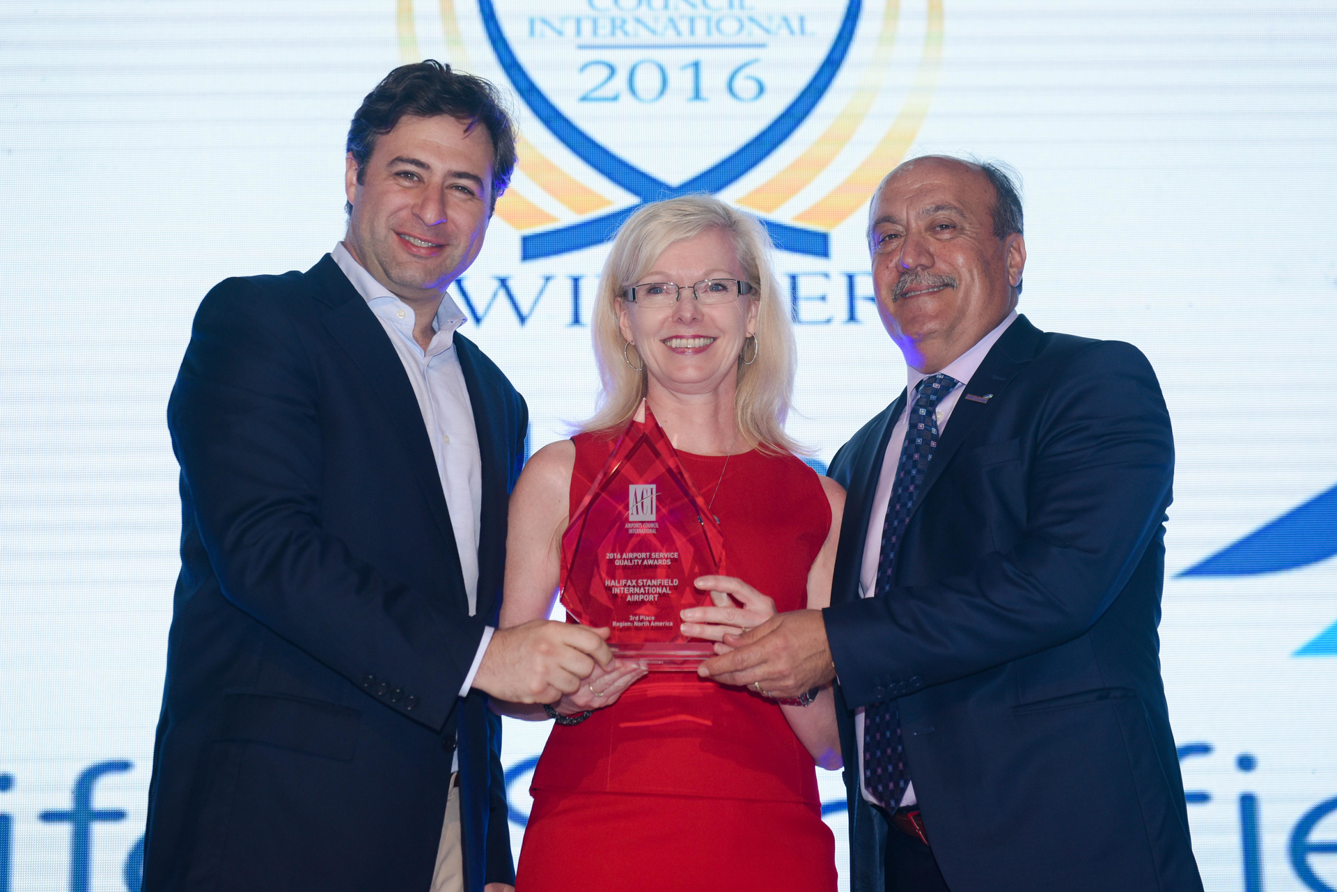 From left to right, Martin Eurnekian, Incoming Vice-Chair, ACI World and CEO, Corporaci&oacute;n Am&eacute;rica presents Joyce Carter, President and CEO, HIAA and Wadih Fares, Chair, HIAA Board of Directors with their 2016 ASQ Award at the ASQ Awards Ceremony in Mauritius.