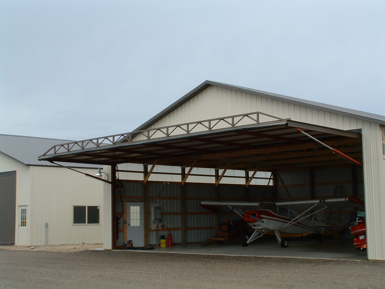 For long-term durability and safety through strong winds, select a door made of all-steel construction.