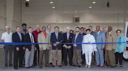 Port of South Louisiana Commission Treasurer P. Joey Murray, III and Executive Director Paul Aucoin (center) ceremoniously open KAPS’ first transient hangar, joined by St. John the Baptist Parish Assessor Lucien Gauff, (fourth from the left), LA DOTD Assistant to the Secretary for Policy Chance McNeely (fifth from the right), and St. John the Baptist Parish President Natalie Robottom.