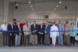 Port of South Louisiana Commission Treasurer P. Joey Murray, III and Executive Director Paul Aucoin (center) ceremoniously open KAPS&rsquo; first transient hangar, joined by St. John the Baptist Parish Assessor Lucien Gauff, (fourth from the left), LA DOTD Assistant to the Secretary for Policy Chance McNeely (fifth from the right), and St. John the Baptist Parish President Natalie Robottom.