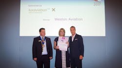 Becky Carver (Managing Director of Weston Aviation) receiving the Award from BACA Chairman Richard Mumford and George Galanopoulos, Managing Director of Luxaviation UK