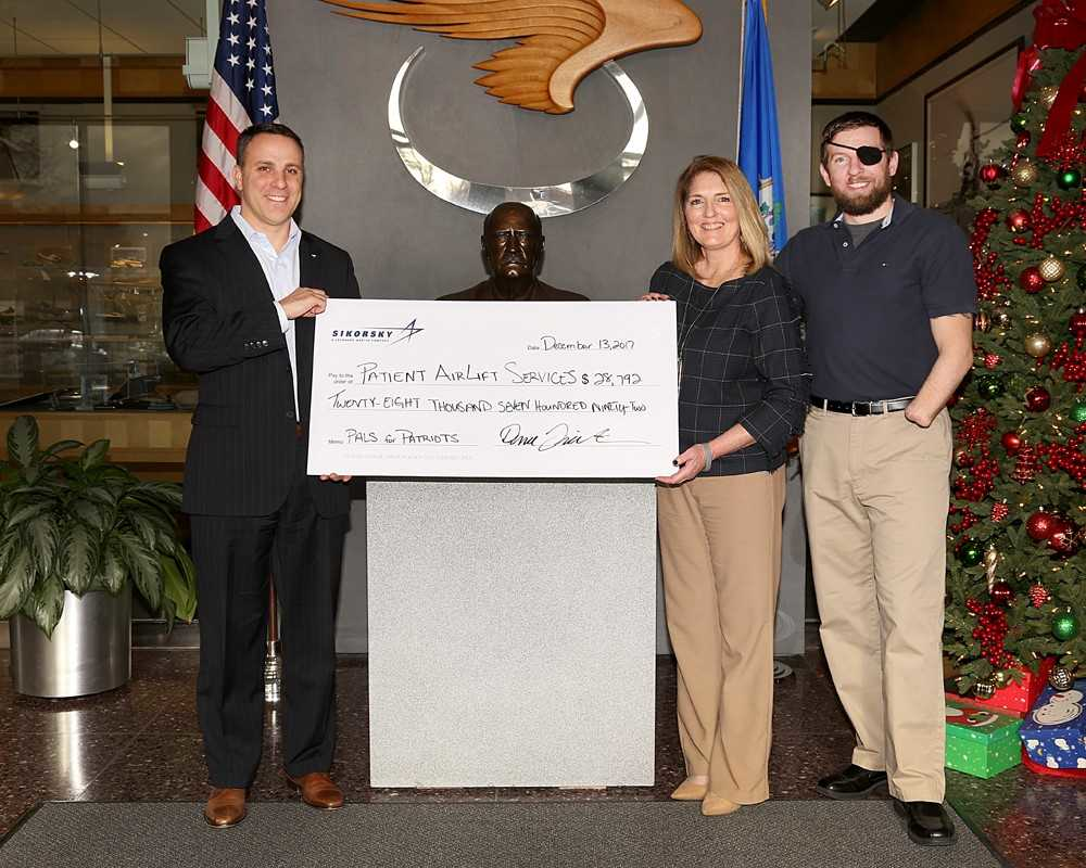 Dana Fiatarone, Sikorsky Vice President, Commercial Systems & Services; Eileen Minogue, PALS Executive Director; and Marine Staff Sgt. David Crouse, a Connecticut Wounded Warrior