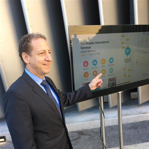 Los Angeles World Airports Chief Innovation and Technology Officer Justin Erbacci demonstrates the new in-terminal maps using LAX during a Tuesday afternoon news conference.