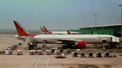 Air India A320 and Boeing 777 300ER S at Indira Gandhi Airport Delhi India February 2013 1 5a4b9e5a9a956