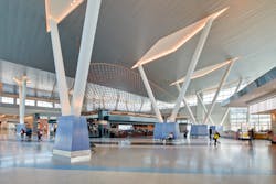 Central concourse 'hub' features soaring 48-foot V columns, which support the wing-inspired roof above. Central concourse 'hub' features soaring 48-foot V columns, which support the wing-inspired roof above.