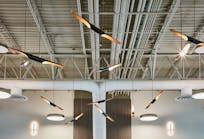Light fixtures on the ceiling resemble propellers at Atlantic Aviation&apos;s terminal in Waukesha, Wis.