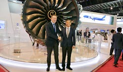 Dominic Horwood, Rolls-Royce, Director Customers and Services – Civil Aerospace (left) and Lau Hwa Peng, Singapore Airlines, Senior Vice President (Engineering) celebrate the signing of the contracts in front of a Trent 1000 engine at Singapore Airshow. Dominic Horwood, Rolls-Royce, Director Customers and Services – Civil Aerospace (left) and Lau Hwa Peng, Singapore Airlines, Senior Vice President (Engineering) celebrate the signing of the contracts in front of a Trent 1000 engine at Singapore Airshow.