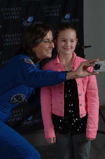 Astronaut Nicole Stott with a young WAI attendee.