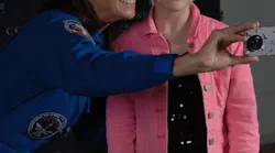 Astronaut Nicole Stott with a young WAI attendee.