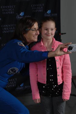Astronaut Nicole Stott with a young WAI attendee. Astronaut Nicole Stott with a young WAI attendee.