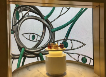 In addition to the promo pod, two 12 ft. x 7 ft., 4mm pixel pitch NanoLumens curved displays adorn the top of a product kiosk along the main terminal walkway.