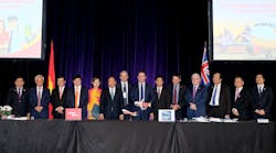 Vietnam Prime Minister Nguyen Xuan Phuc and senior leaders of Vietnam and Australia witness the signing ceremony.