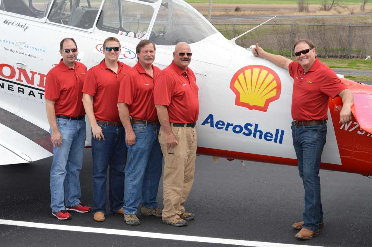 Members of the Shell Aviation Lubricants Team and AeroShell Aerobatic Team celebrate the signing of the new agreement in Tallulah, LA. From left to right: Jon Stoy, General Aviation Manager; and Rodney Eckert, Marketing Manager, from Shell Aviation Lubricants; with Mark Henley, Team Lead; Jimmy Fordham, Slot; and Steve Gustafson, Left Wing, from the AeroShell Aerobatic Team.