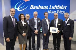 Prof. Dr. Mirko Hornung (Executive Board, Bauhaus Luftfahrt, 5th from left), Insa Ottensmann (Executive Board, Bauhaus Luftfahrt, 2nd from left), Axel Flaig (Advisory Board, Airbus, 4th from left), Prof. Dr. Rudolf F. Schwarz (Advisory Board, IABG, 3rd from left), Josef Gropper (Advisory Board, Liebherr, 7th from left), and Lars Wagner (Advisory Board, MTU Aero Engines, 1st from left) with outgoing Chairman Dr. Rainer Martens (6th from left). Prof. Dr. Mirko Hornung (Executive Board, Bauhaus Luftfahrt, 5th from left), Insa Ottensmann (Executive Board, Bauhaus Luftfahrt, 2nd from left), Axel Flaig (Advisory Board, Airbus, 4th from left), Prof. Dr. Rudolf F. Schwarz (Advisory Board, IABG, 3rd from left), Josef Gropper (Advisory Board, Liebherr, 7th from left), and Lars Wagner (Advisory Board, MTU Aero Engines, 1st from left) with outgoing Chairman Dr. Rainer Martens (6th from left).