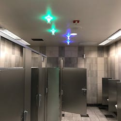 Green lights indicate a stall is empty while blue lights indicate the location of a handicap-accessible stall.