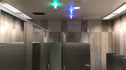 Green lights indicate a stall is empty while blue lights indicate the location of a handicap-accessible stall.