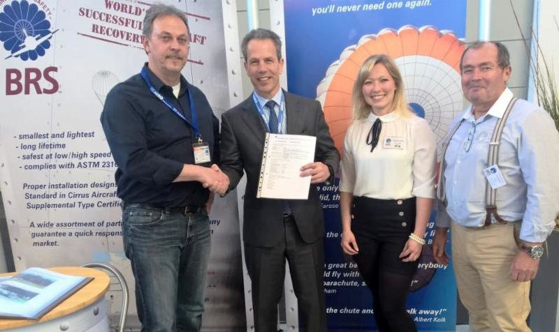 (L-R) Technical Officer of DAeC Michael Baetz presents ultralight Type Certificate to BRS Aerospace CEO Fernando de Caralt and BRS Aerospace German representatives Stefanie and Frank Miklis.