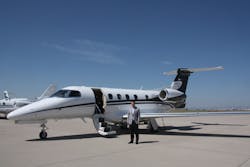 Company President and CEO John Owen stands in front of an Executive AirShare Embraer Phenom 300 at Centennial Airport. Company President and CEO John Owen stands in front of an Executive AirShare Embraer Phenom 300 at Centennial Airport.
