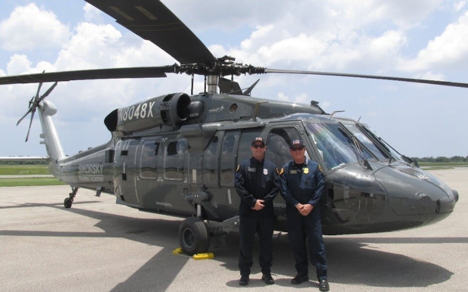 San Diego Fire-Rescue Senior Pilot Chris Hartnell (left) and Chief Chuck Macfarland accepted the department&rsquo;s first S-70 Black Hawk helicopter June 27 from Sikorsky.