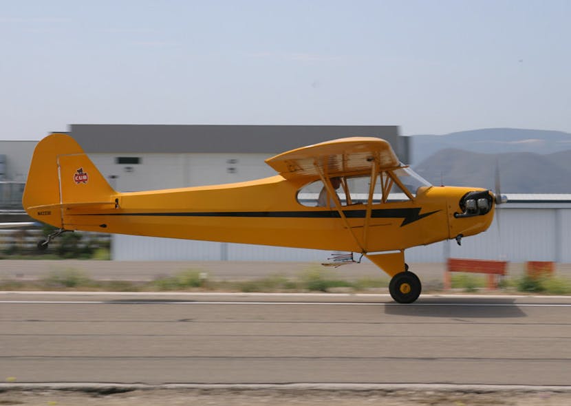 A vintage Piper Cub touches down at the Lompoc Airport during a previous WEST COAST CUB FLY-IN event. This year marks the fly-in&apos;s 34th anniversary.