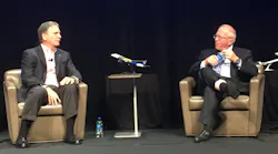 Spirit Airlines CEO Bob Fornaro, left, talks with Boyd Group International President Michael Boyd about the state of his airline and the impact it's having on commercial airport traffic.