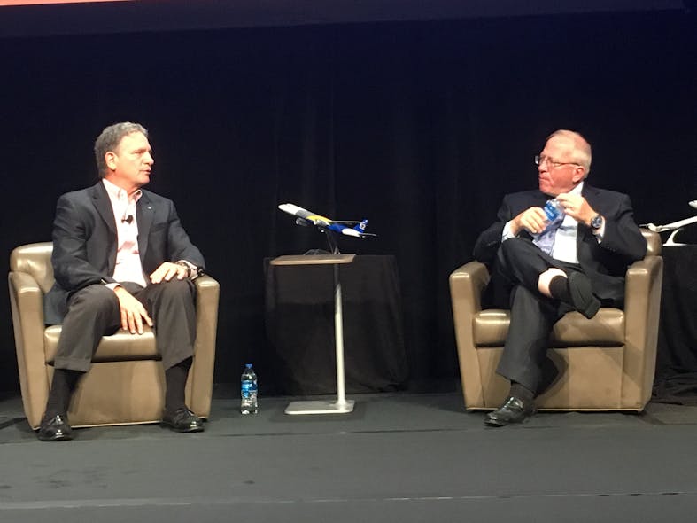 Spirit Airlines CEO Bob Fornaro, left, talks with Boyd Group International President Michael Boyd about the state of his airline and the impact it&apos;s having on commercial airport traffic.