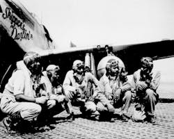 Fliers of a P-51 Mustang Group of the 15th Air Force in Italy `shoot the breeze&apos; in the shadow of one of the Mustangs they fly. Left to right: Lt. Dempsey W. Morgan, Jr.; Lt. Carroll S. Woods; Lt. Robert H. Nelson, Jr.; Capt. Andrew D. Turner; and Lt. Clarence P. Lester.